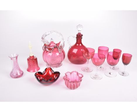 Twelve items of cranberry glassware to includeA bulbous decanter with spiralled clear glass handle and stopper, a basket with