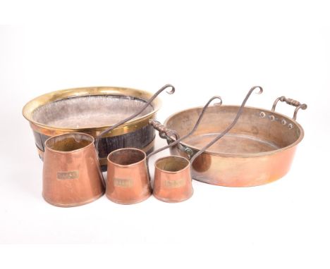 Oak and brass bound planter with lead lining, early 20th CenturyHeight 12.5cm, diameter 35.5cm, three copper measuring jugs, 