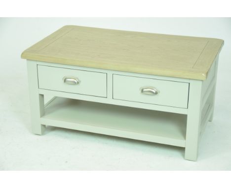 A modern stained oak and painted centre tableWith a slab top above a pair of frieze drawers each with opposing brush metal ha