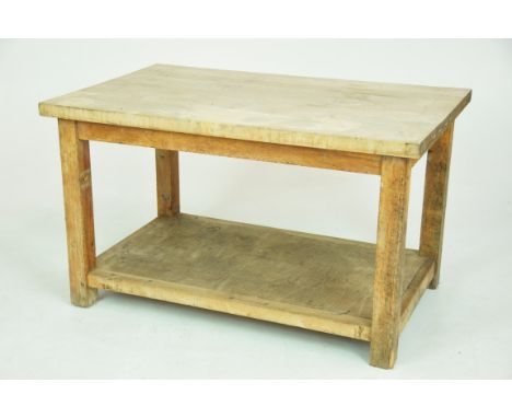 A rustic pine slab top work or butchers tableWith a substantial slab top supported on plain pine square section supports with