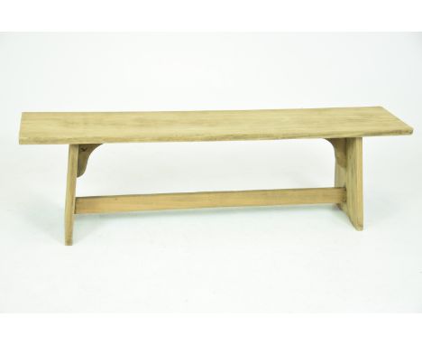 A 20th Century light oak benchThe rectangular top raised on bracket supports with a plain cross stretcher, 153x46x32cms