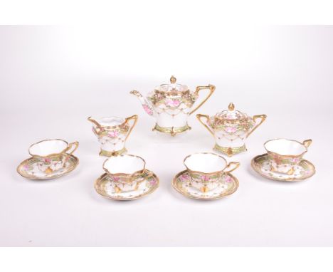 A Noritake rose pattern eleven piece tea serviceEach piece decorated with roses and beaded gilt swags, heavily gilded borders