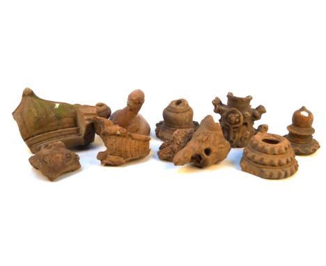 A collection of various Majapahit clay pottery architectural fragments
Comprising approximately seventeen examples, all in zo