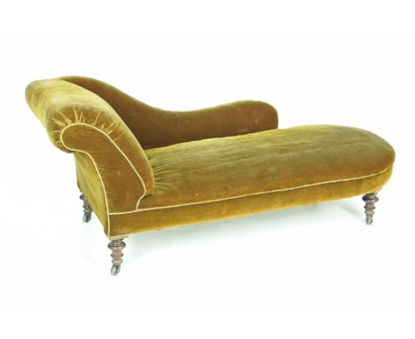 A Victorian walnut and upholstered chaise lounge, stamped J. MillsWith a padded scroll and downswept padded back above a roun