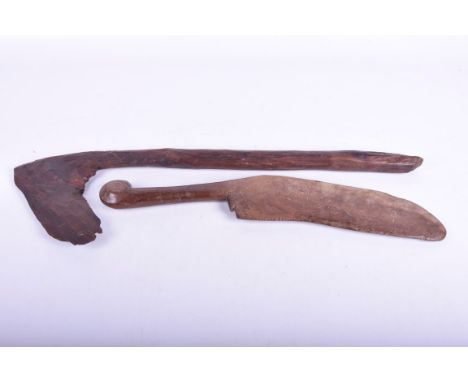 Two African weapons
To include a tribal axe, carved in typical form from one piece of wood, 60cm long, together with a carved