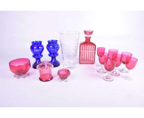 Fourteen items of decorative glassware to includeA modern cut glass tapering vase with a star cut base, cranberry glass wines