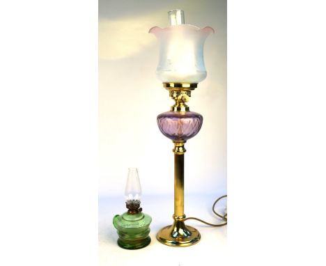 A modern reproduction electric table lamp former oil lampThe brass column with purple oil reservoir, glass shade with chimney