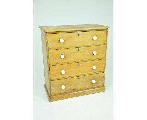 A Victorian pine chest of drawersWith a rectangular plank top above four long drawers each with white ceramic knob handles an