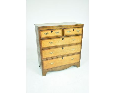 A 19th Century oak and mahogany crossbanded chest of drawersThe rectangular crossbanded top above similarly crossbanded two s