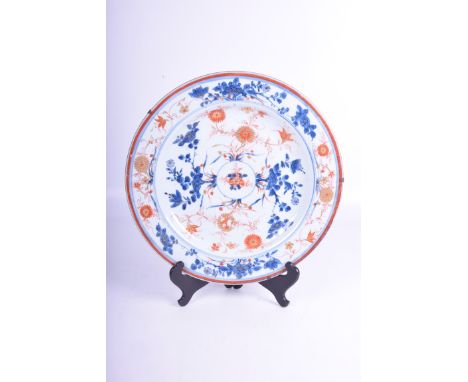 A Chinese Imari porcelain charger, 19th century
Of typical circular form, the central well with roundel issuing chrysanthemum