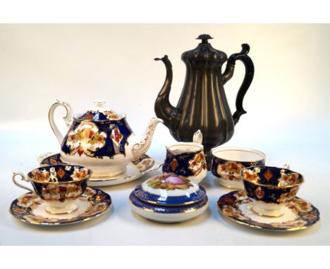 A Royal Albert Heirloom tea serviceComprising six cups and saucers, six cake plates, teapot, milk jug and sugar bowl, and cak