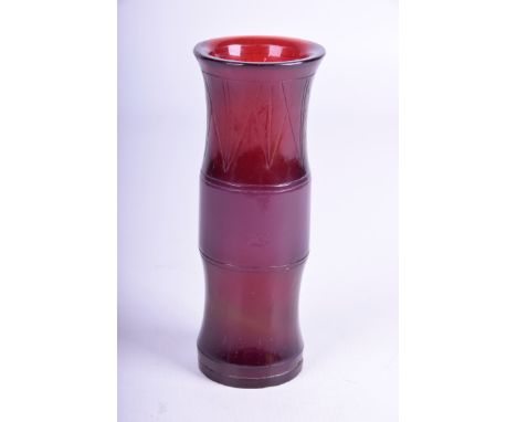 A Chinese ruby-red glass vase, Qianlong four character seal mark (1711-1799) The waisted cylindrical vase, cut with stiff lap