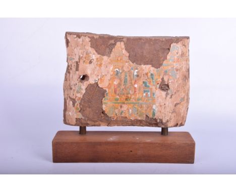 An Egyptian painted wood sarcophagus fragment, possibly 21st Dynasty
Painted in polychrome pigments on paper, laid on wood, d