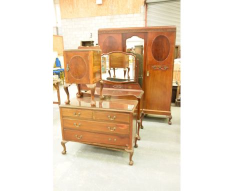 An early 20th Century Chippendale style four piece mahogany bedroom suiteThe wardrobe with a caddy top above a blind fret wor