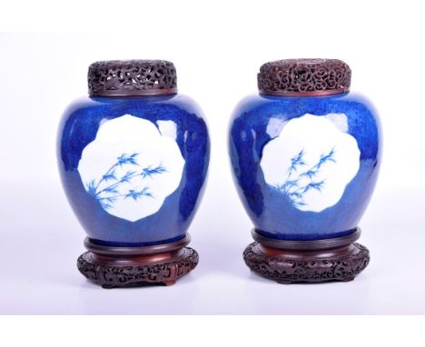 A pair of Chinese powder blue vases, Kangxi period (1662 - 1722)Each of rounded ovoid form, the mottled rich cobalt ground ad