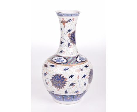 A Chinese porcelain Wucai style vase, 20th century
The rounded body raised on a low footing and extending to a tapered neck w