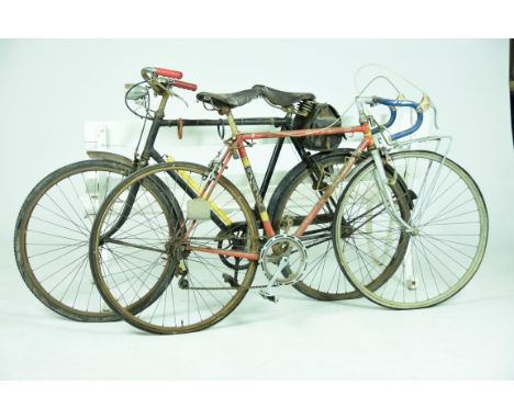 Two vintage bicyclesA Team Raleigh racing bike with drop handlebars and a gentleman's Raleigh bicycle with a Brooks sprung se