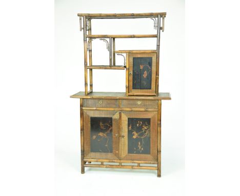 An early 20th Century bamboo and Japanned free standing wall display cabinetThe upper part with a bamboo structure enclosing 