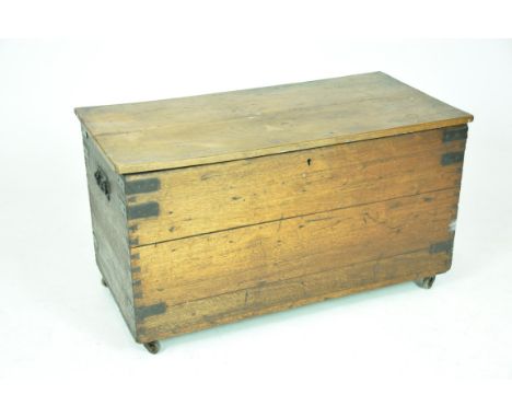 A 19th Century oak blanket chestThe two plank hinge top above a pair of iron swing side handles, the corners mounted with iro