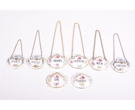 Eight ceramic decanter labels, to include five Hammersley concave examples and three Crown Staffordshire floral pattern examp