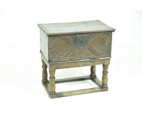 A 17th Century and later oak bible boxThe rectangular hinged top with a serrated carved edge and fitted with iron hinges and 