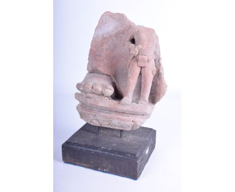 A Majapahit clay architectural fragment, Indonesia, possibly 14th - 15th century 
The fragment with carved foot and figure de