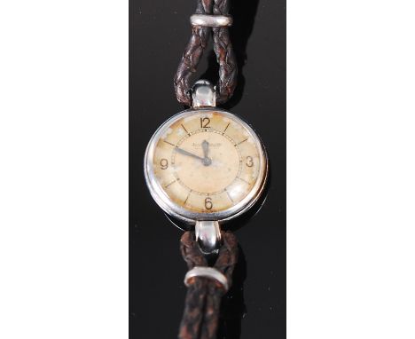 An early 20th century Jaeger LeCoultre platinum ladies wristwatch, having signed enamelled dial (with crazing and discolourat