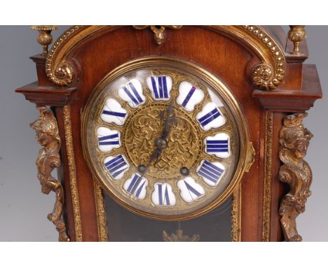 A late 19th century French walnut mantel clock, having gilt metal mounts, the gilt metal dial with white enamel set raised Ro