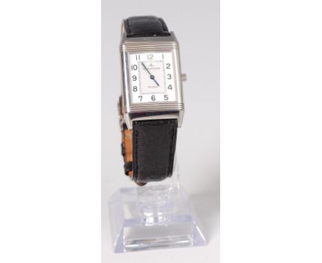 A gents Jaeger le Coultre stainless steel Reverso mechanical wristwatch, having a signed and silvered square dial, w.2.3cm ex