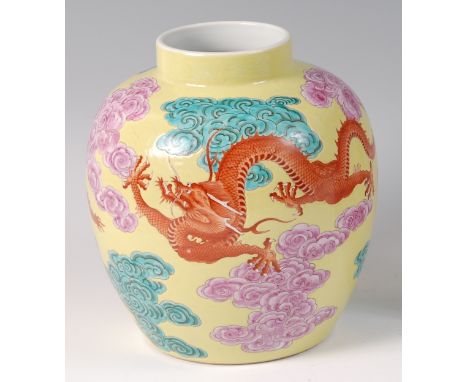 A 19th century Chinese yellow ground dragon vase, of baluster form, enamel decorated with five claw dragons amidst clouds, h.
