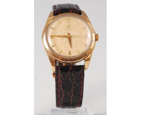 An Omega 9ct gold cased gents dress watch, having signed champagne dial (badly tarnished), gold quarter Arabic numerals, bato