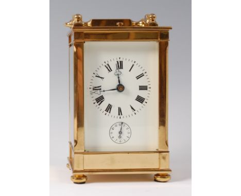 A 20th century French lacquered brass carriage clock, with alarm, having white enamel dial and subsidiary alarm dial, with pu
