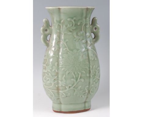 A 19th century Chinese celadon jade stoneware vase, of ovoid form, with incised scrolling foliate and chrysanthemum decoratio