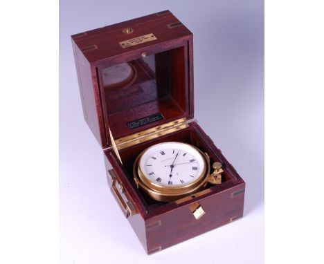 A late 20th century mahogany and gilt brass cased ships clock by Montremo, the brass bound case with double-hinge cover openi