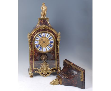 A Louis XVI *faux* tortoiseshell and gilt brass bracket clock, the case surmounted with a standing figure (probably associate