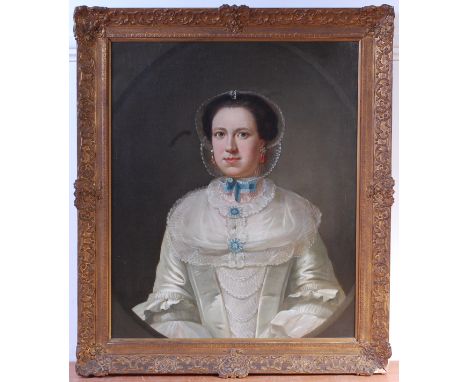 Circa 1800 English school - Half-length portrait of a lady wearing a lace bonnet and ruby set ear pendants, oil on canvas (re