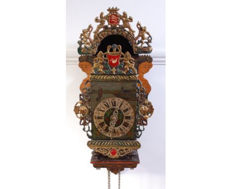 A 19th century Dutch polychrome painted metal lantern clock, on further painted wooden bracket, the dial decorated with river