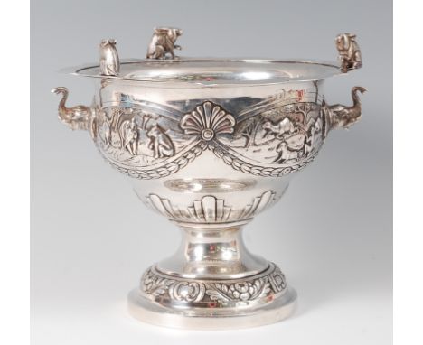 A late 19th century Anglo-Indian white metal pedestal bowl, the flat rim surmounted with three seated squirrels, the body rep