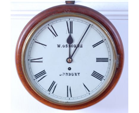 A late Victorian mahogany circular dial school clock, the white enamel dial signed W Osborne Sudbury, single winding hole for