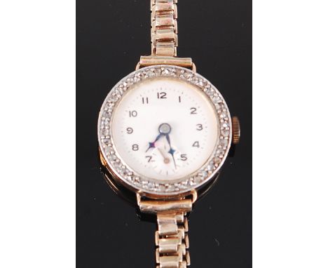 A ladies 18ct gold diamond set cocktail watch, having silvered dial with subsidiary seconds dial, within pavé set surround of