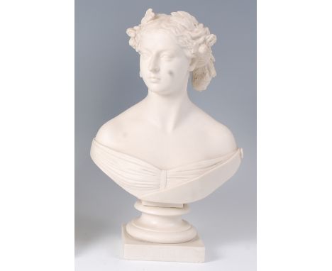 A Minton Parian porcelain portrait bust of the young Queen Victoria, circa 1850, modelled by C Marochetti, with artist signat