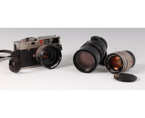 A Leica M6 Rangefinder camera, serial number 1936579, having Leica Summilux-M 114-35 lens, in fitted black leather case; toge