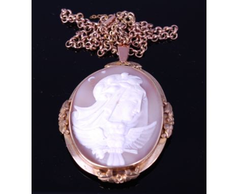 A Victorian carved shell cameo brooch, depicting profile portrait of the goddess Minerva with her owl, in 9ct gold mount, 5.5