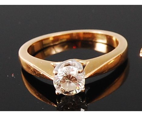 An 18ct gold diamond solitaire ring, the four claw set brilliant weighing approx 0.62ct, we would assess diamond colour as G/