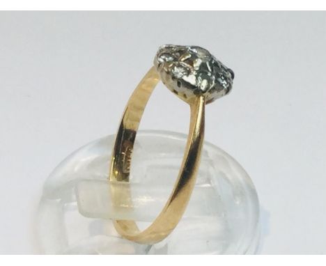 An 18ct yellow gold diamond ring in a daisy cluster design, set with 9 x round brilliant cut diamonds, estimated total diamon
