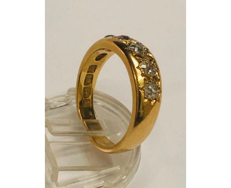 A gents 18ct yellow gold diamond ring, set with five old Victorian cut diamonds in a star setting, ring weighs 8.6 grams, fin