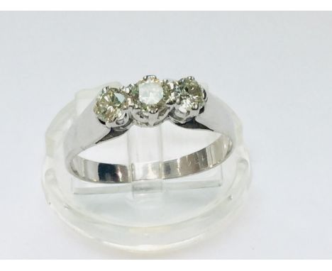 An 18ct white gold diamond ring, set with three round brilliant cut diamonds in a claw setting, estimated total weight of dia