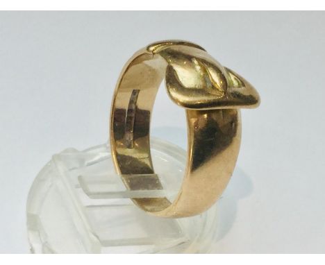 A gents 9ct gold buckle ring, weighs 7.3 grams, finger size V. 