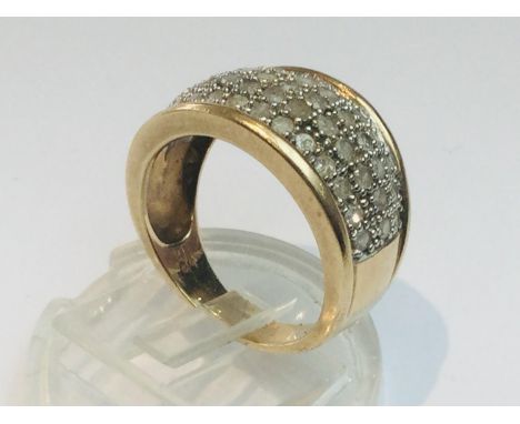 A 9ct yellow gold ring, set with small round brilliant cut diamonds set in a pave style, ring weighs 4.8 grams, finger size L