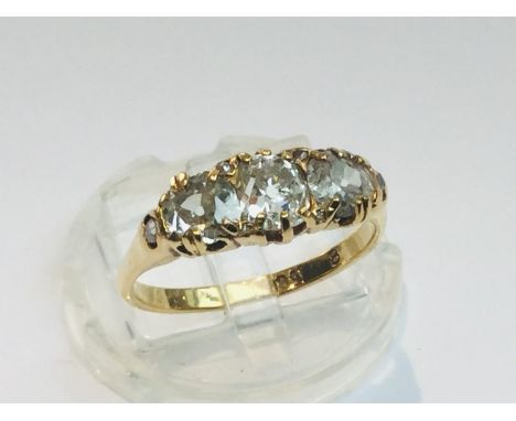 An 18ct yellow gold diamond ring, set with three old Victorian cut diamonds in a double claw setting, estimated weight of dia